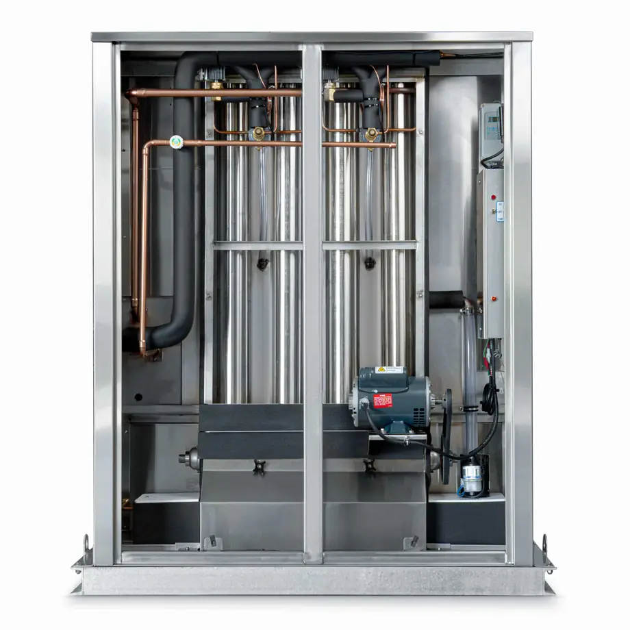 Arctic-Temp® ice machine with open side panel beside its air-cooled condenser, showing evaporator tubes and motor