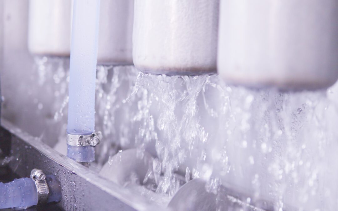 Commercial ice machine evaporators with flowing water, emphasizing hygienic ice production for food safety in beverage operations.