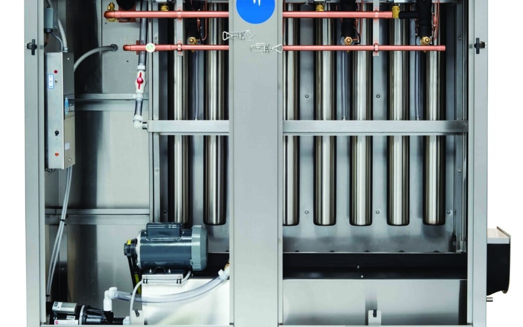 Industrial ice maker machine with stainless steel components and copper piping, showcasing advanced ice production technology for commercial applications.