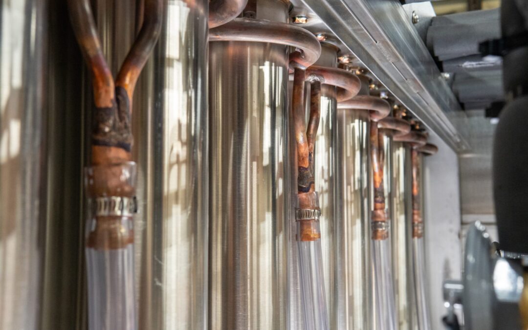 Vertical tube industrial ice machine components showing copper tubing and stainless steel tubes, illustrating technology for high-quality, consistent ice production.